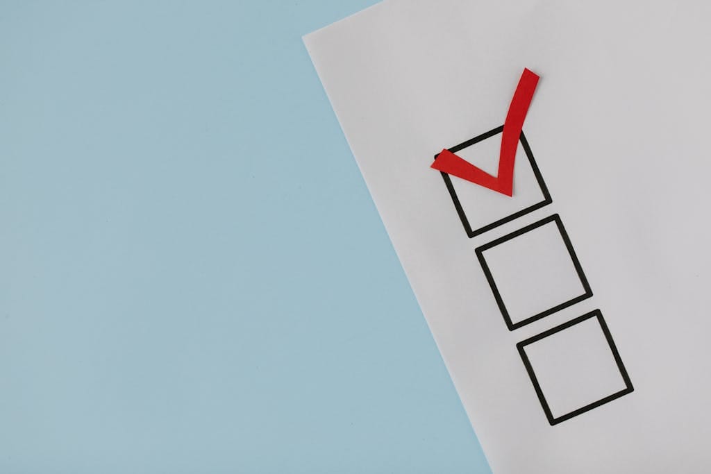 a simple white paper checklist with one red checkmark ideal for concepts like completion or approval. 8850706 1024x683 2